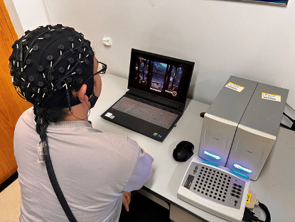 HIED participant wearing an EEG cap during movie stimulation